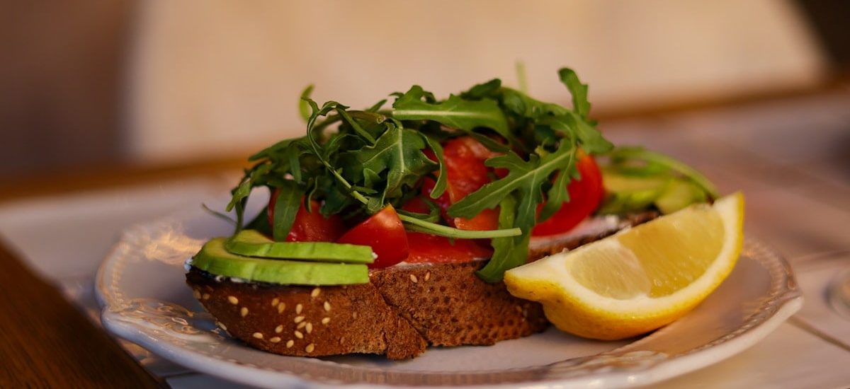 a sandwich with salmon and avocado for lunch